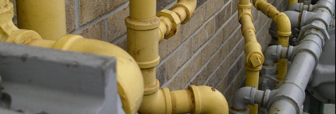 large pipes against a cloudy sky